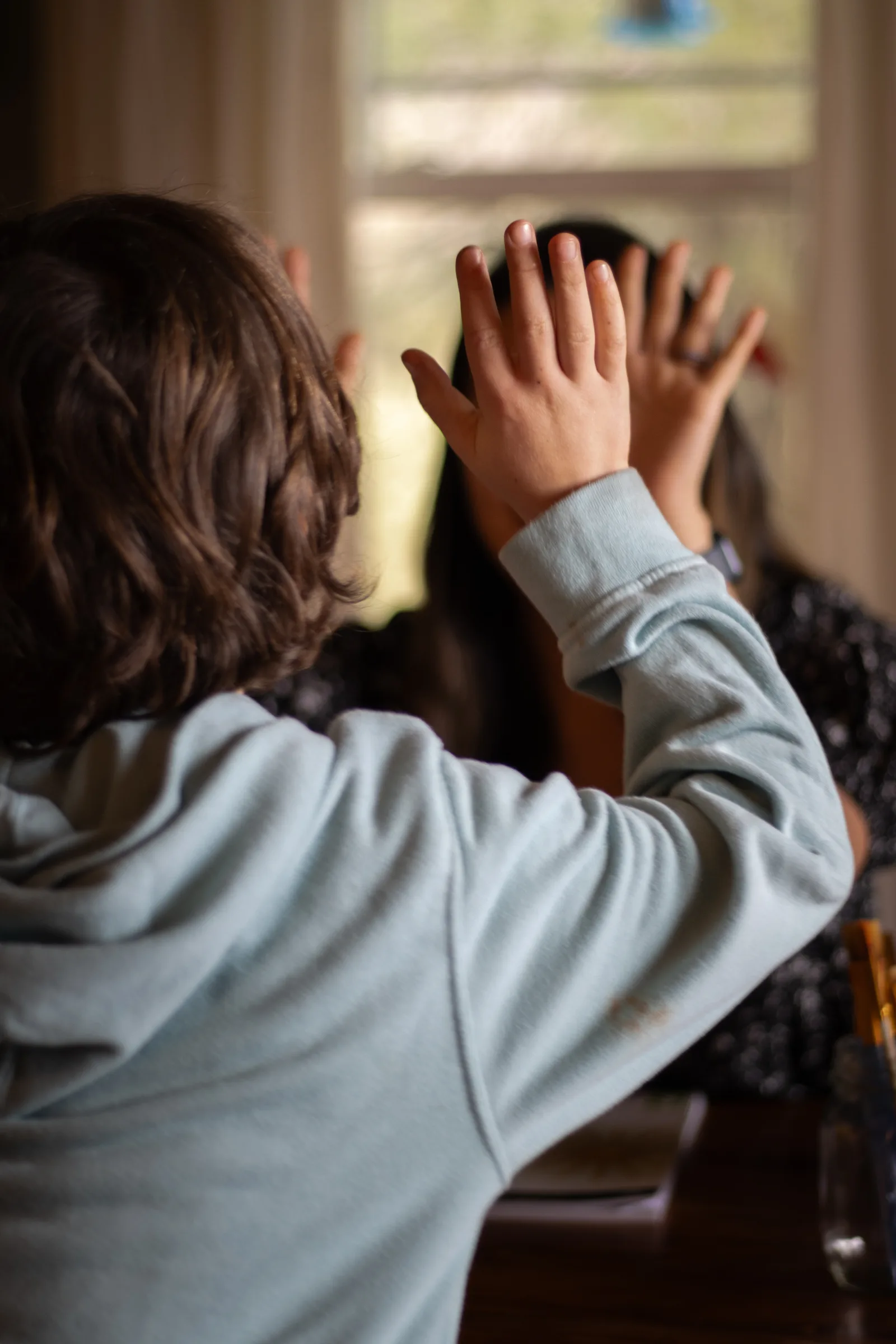 A student celebrating a breakthrough during tutoring